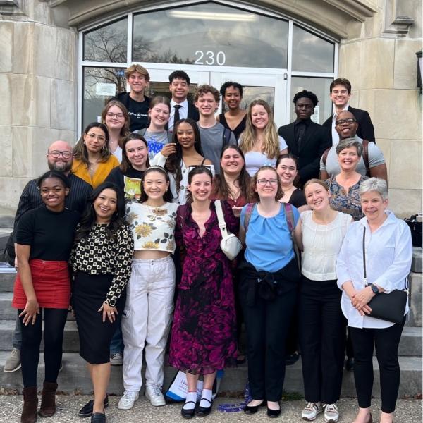 a group smiles at the camera