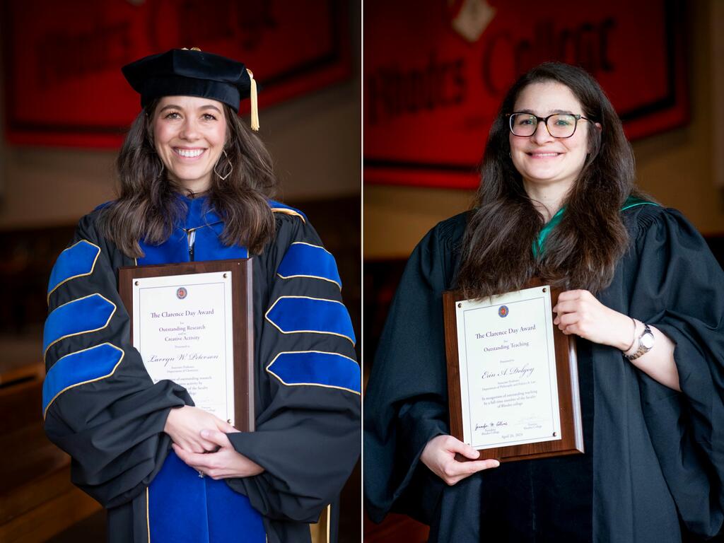 image of Profs. Erin Dolgoy and Larryn Peterson, each holding plaques