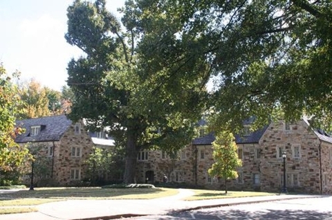 a stone building with a slate roof