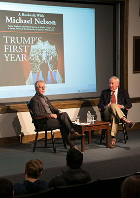 two professors on a stage