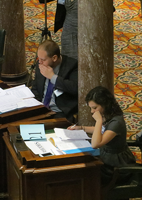 students study legislative papers 