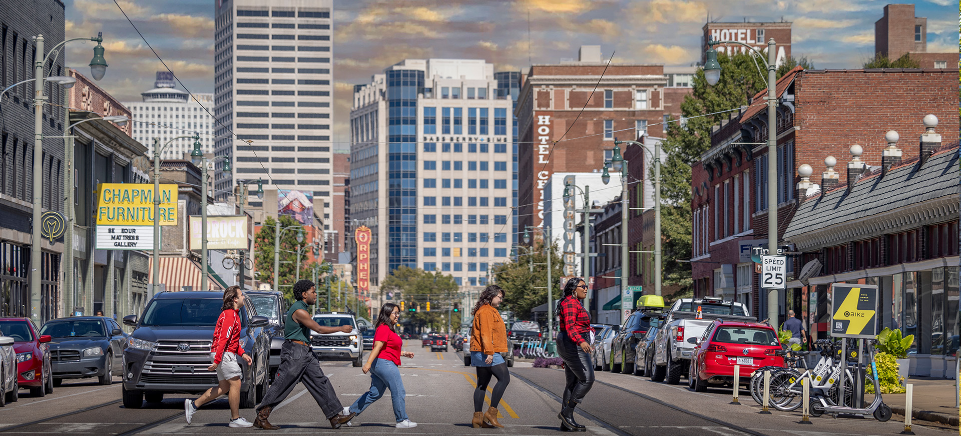 students cross a downtown street