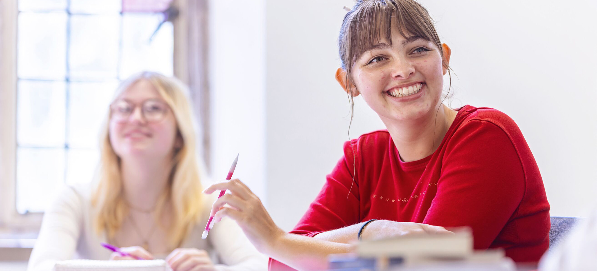 two students in a classroom