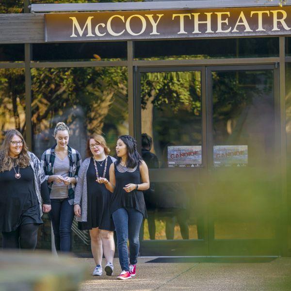 A line of students walk outside the McCoy Theatre