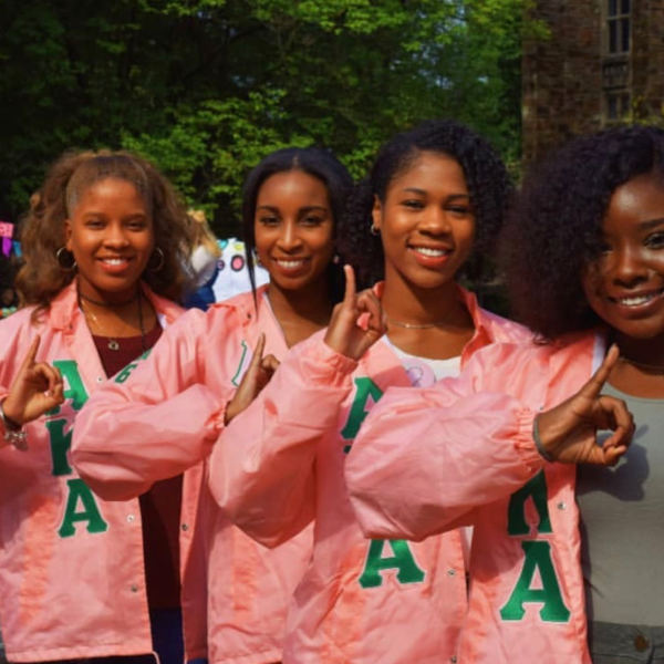 Four women in pink jackets