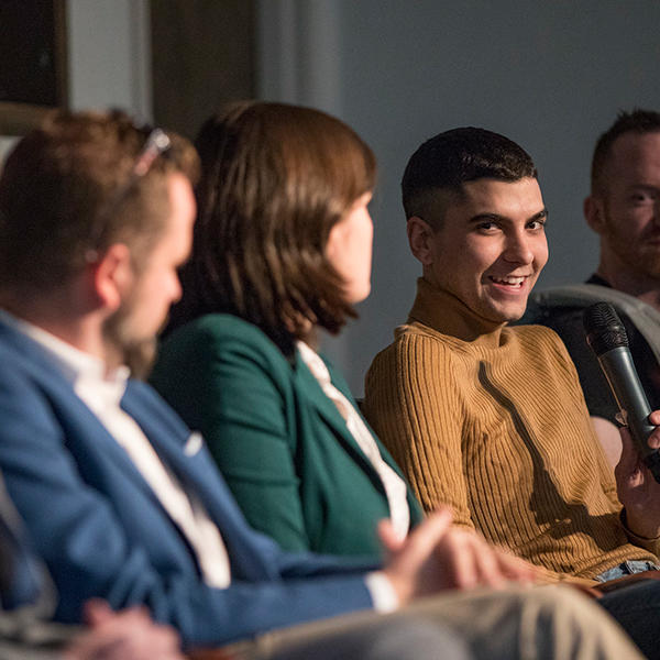 male and female participants on a panel