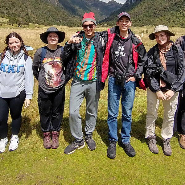 a group of students with mountains in the background
