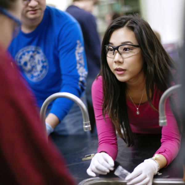 Student wearing protective glasses at laboratory