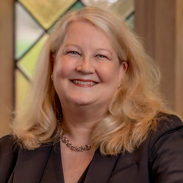 headshot of a woman with long blonde hair