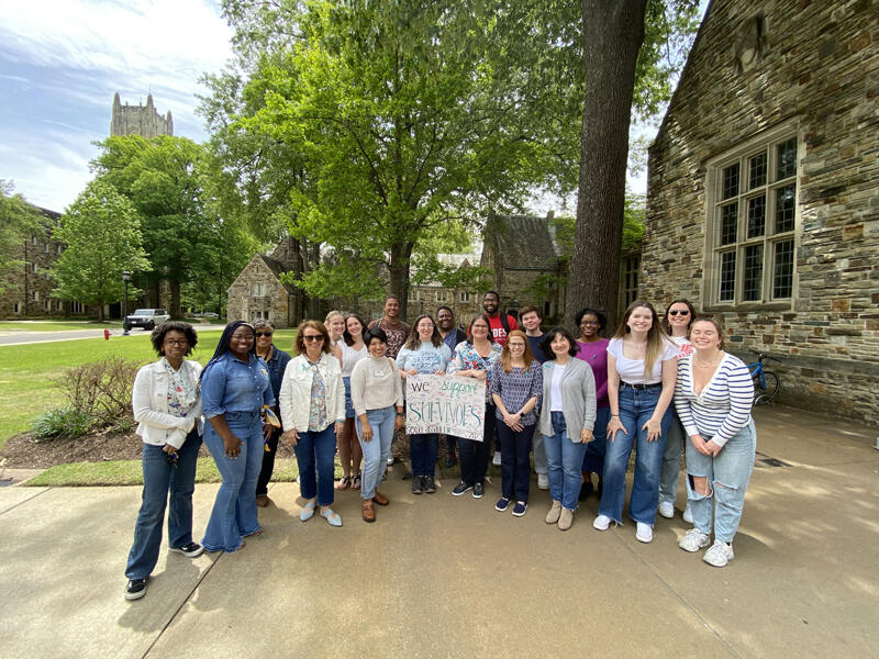 a group of people wearing jeans