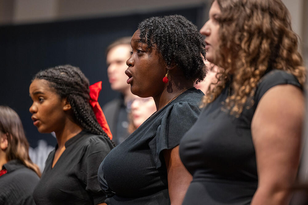 three female students singing